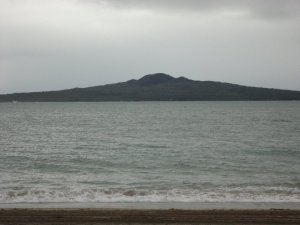 view of rangitoto from mission bay. the volcano is the epicentre of the north shore.